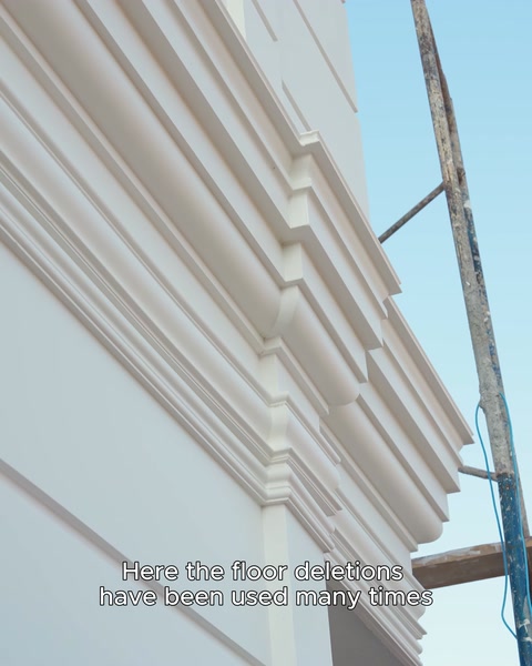 A combination of different moulding profiles is visible on a wall corner
