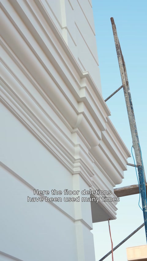 Multi-layered band course detail extending across the facade