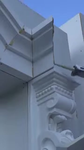 The completed corner joint of the cut window trim pieces is shown in close-up