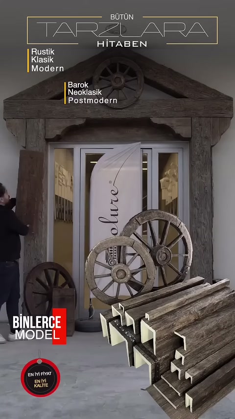 Sezioni di travi e varietà di ruote vengono presentate davanti all'ingresso rustico