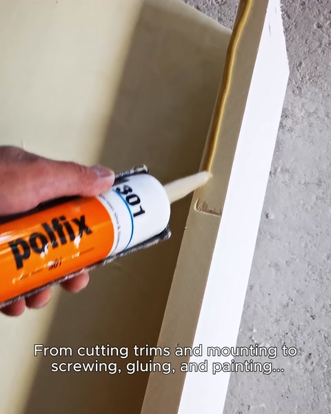Applying Pollix adhesive along the edge of a window surround