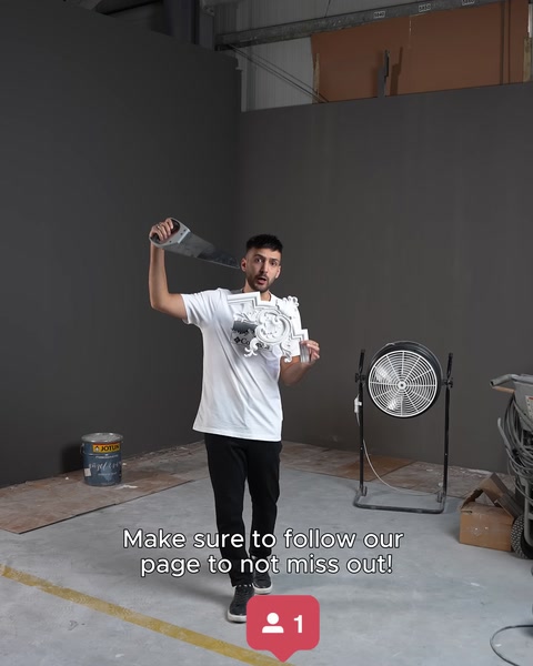 Installation technician raising an arm and inviting viewers to follow