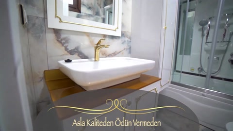 A marble-look wall and mirror arrangement around the bathroom sink