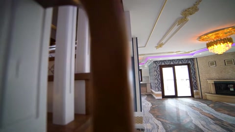 Wall moldings and ceiling borders stand out in the hallway opening