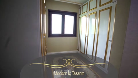 Gold-colored wall moldings and ceiling trim in an empty room