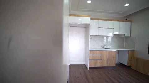A simple ceiling border and wall transitions in the open kitchen