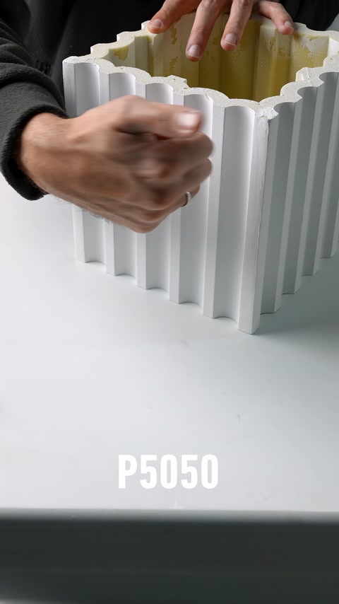 The impact resistance of a fluted polyurethane column shaft is tested by hand