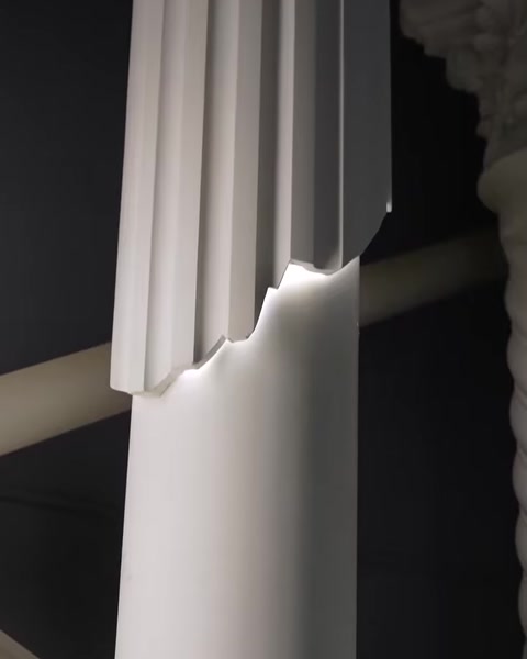 Decorative column crown molding illuminated by hidden LED lighting