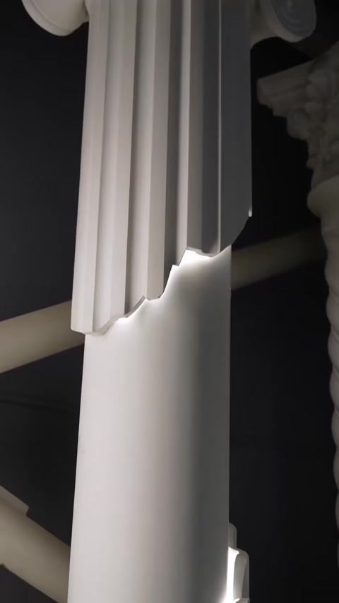 Decorative column crown molding illuminated by hidden LED lighting