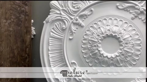 A circular ceiling medallion with fine relief is shown standing upright