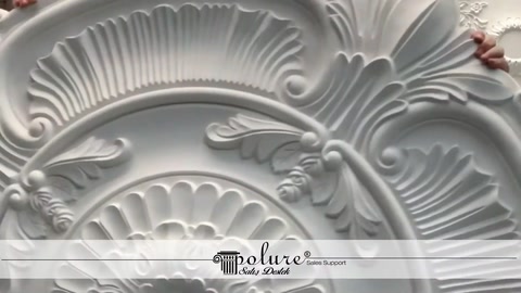 Fan-shaped reliefs and curved leaf decorations are shown in close-up
