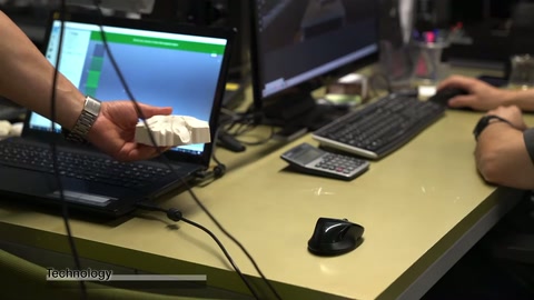 Designer adjusts decorative component drawing on computer in office workspace