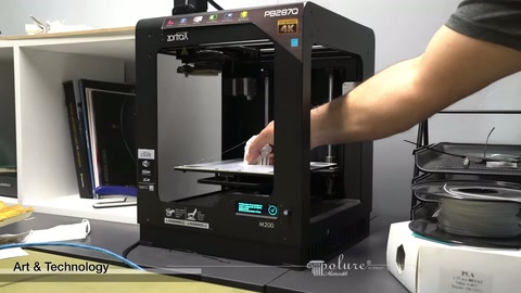 Completed white part removed by hand from three-dimensional printer bed