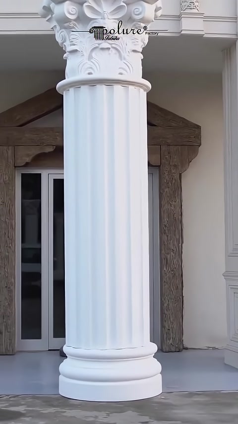 A vertically fluted column shaft and a plain pedestal are visible