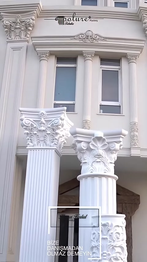 Columns with Corinthian capitals and patterned bases are seen completed