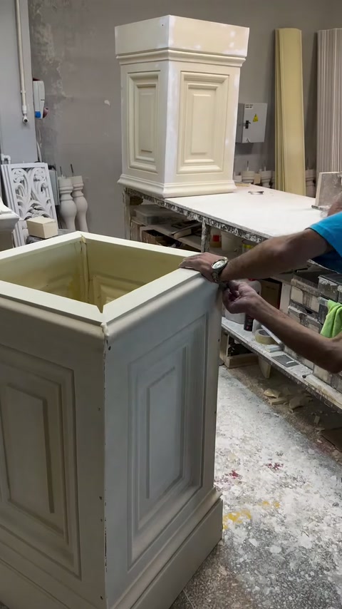 Open pedestal structure reveals its hollow interior during workshop finishing.