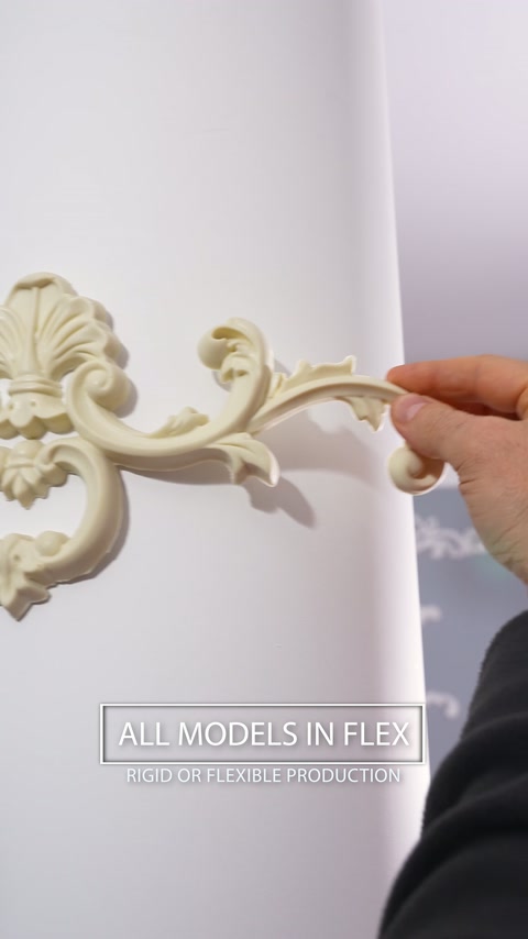 Close-up shows flexible floral ornament conforming to a rounded column.