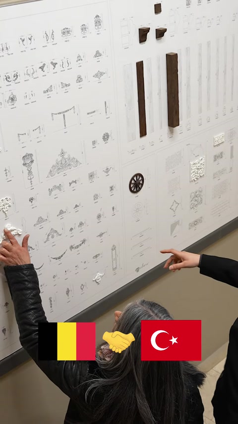 Decorative product placements and hall plan examined on the work board