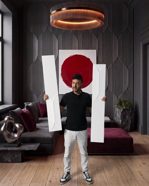 Man holding two panels displaying bold color and pattern combination