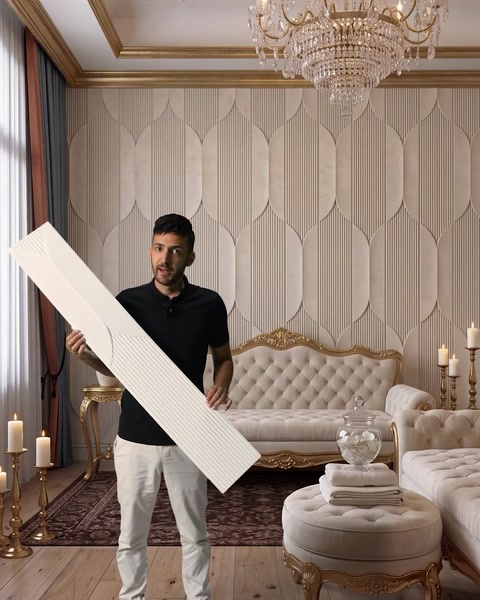 Man carrying a single panel through an elegant furnished entryway