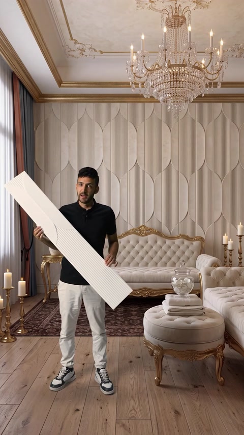 Man carrying a single panel through an elegant furnished entryway