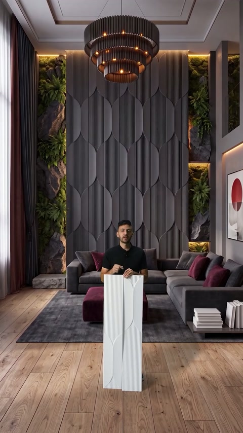 Presenter compares panel sections against a finished charcoal feature wall