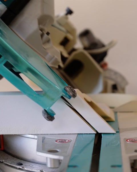 Workshop machine cutting a polyurethane profile to shape