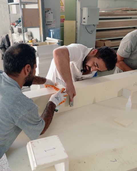 Fitting a decorative block onto the arch component during preparation