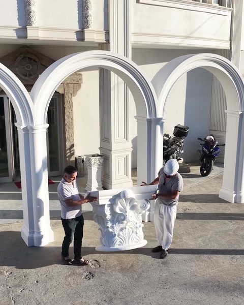 Decorative capital carried to the arcade during outdoor assembly