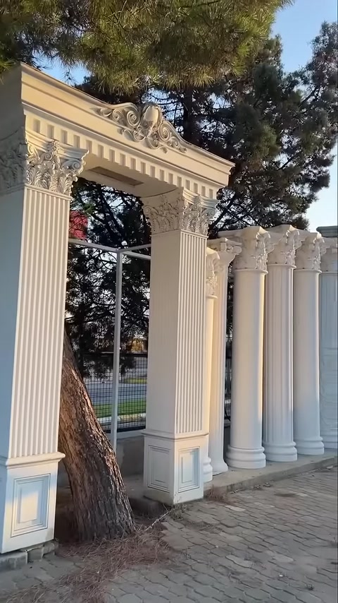 Columns with Corinthian capitals are displayed with classic upper ornamentation