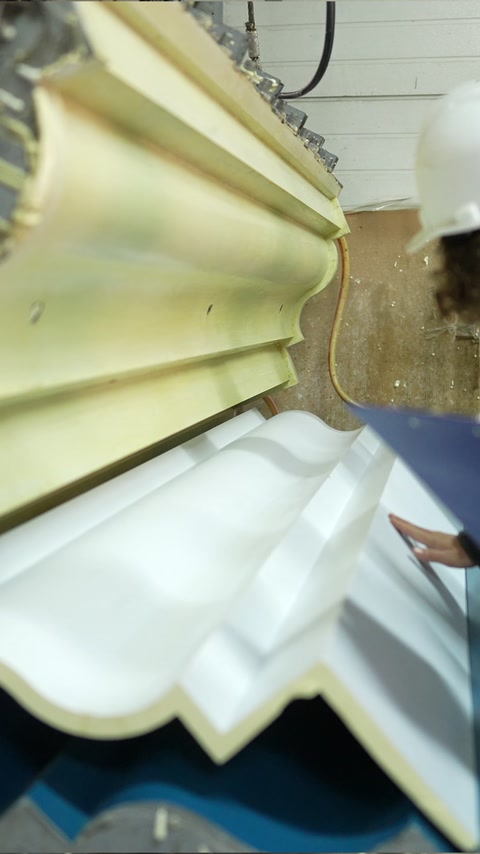 Layered cornice profiles display several distinct decorative shapes.