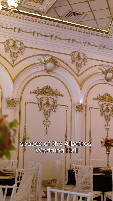 Arched hall walls decorated with gold applique panels