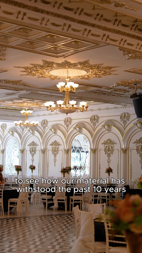 Arched windows with chandeliers and gold cornice ceiling