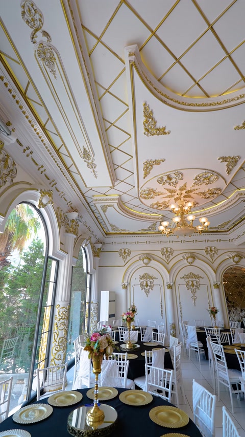 Hall corner with windows, columns, and coffered ceiling