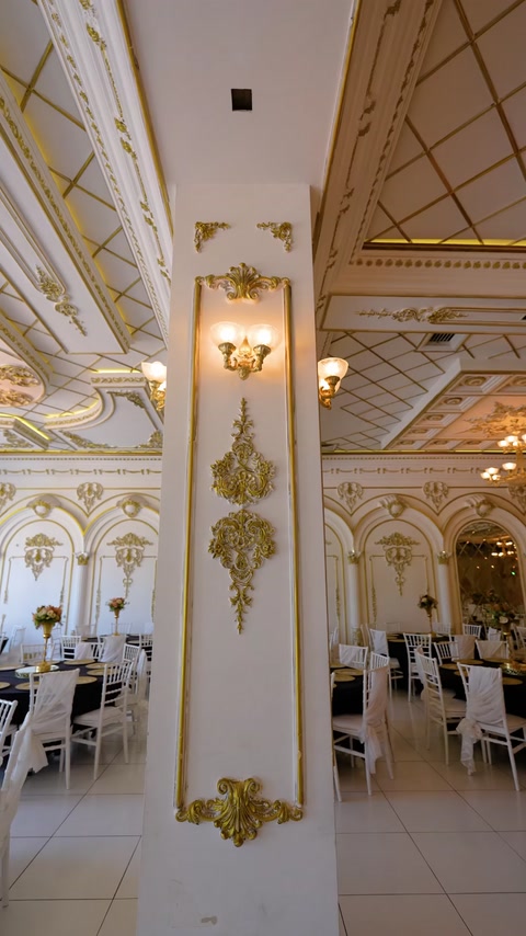 Decorative pilaster column with applique panel and wall sconce