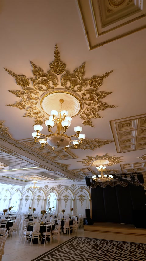 Wide ceiling view with large gold medallion and chandelier