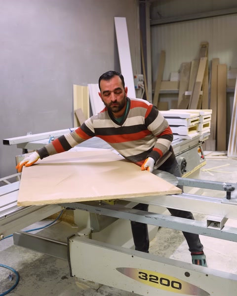 Cutting a large MDF board on a workshop table saw
