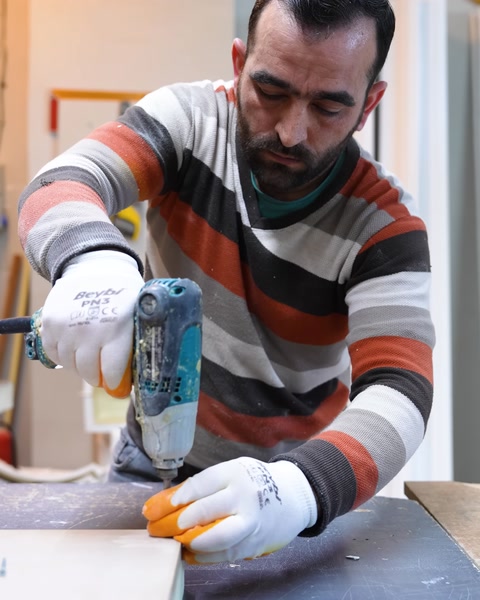 Assembling and securing the wooden tabletop frame with a drill