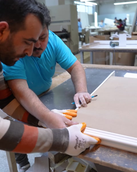 Marking measurements with a pencil on a polyurethane trim strip