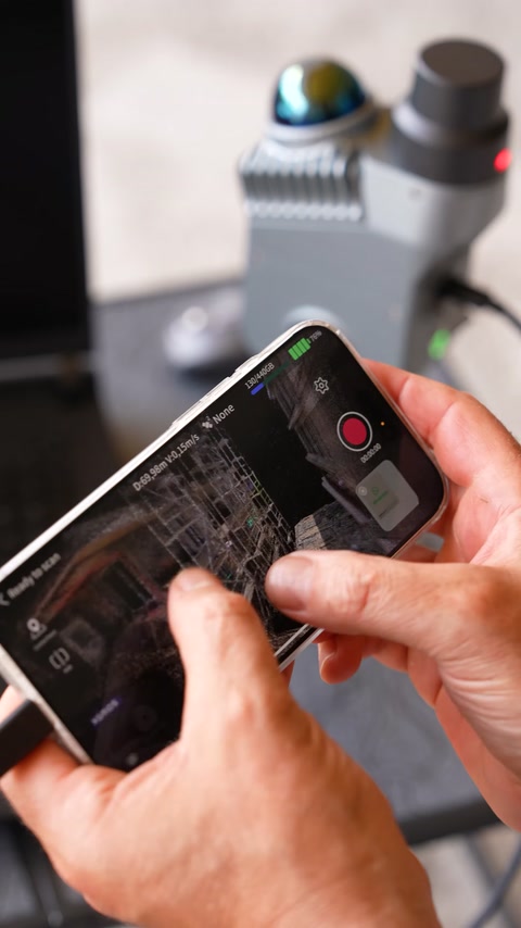 Hands explore digital architectural decoration designs on a smartphone