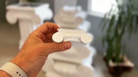 The video shows a white polyurethane profile cross-section being examined by hand.