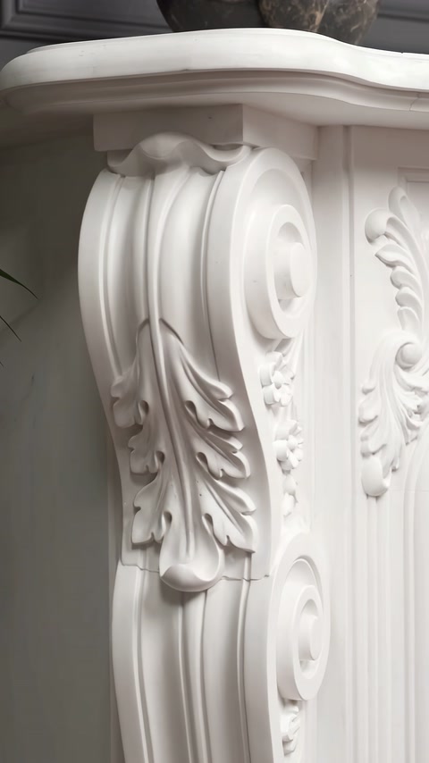 Side ornament features deep scrolls beneath the projecting mantel shelf