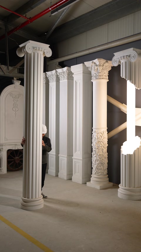 Different pilaster models lined up in front of a column with an Ionic capital