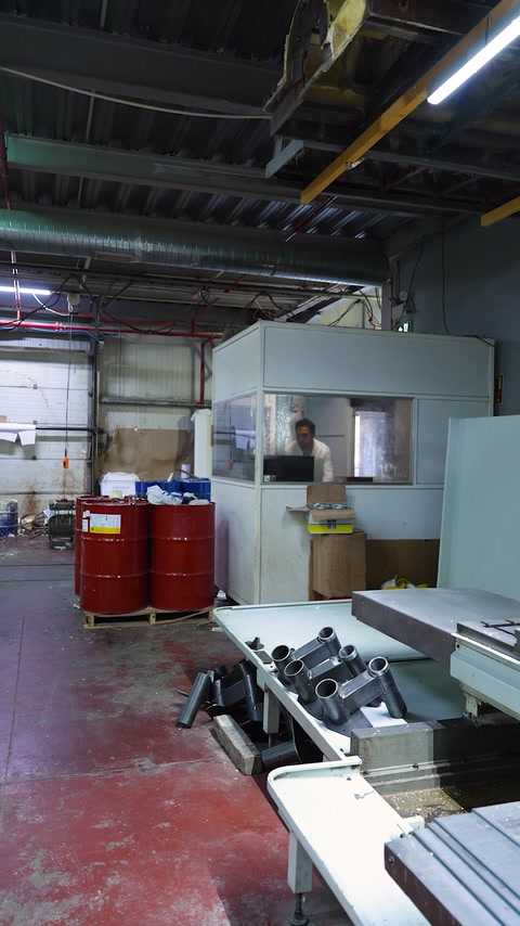Factory floor shows CNC equipment and large panel production areas