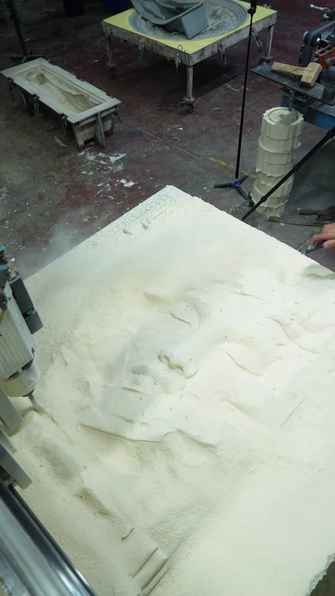 Close-up shows intricate relief carving across the unfinished panel