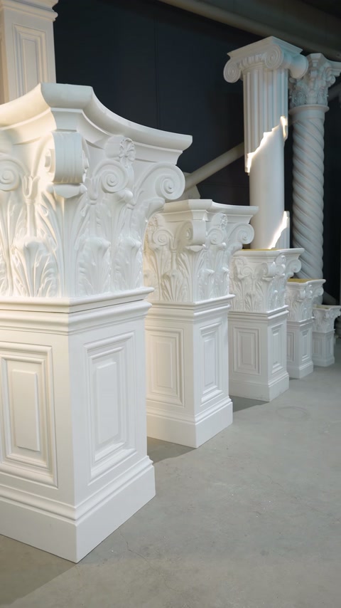 Side perspective reveals carved capital profiles across the indoor display lineup