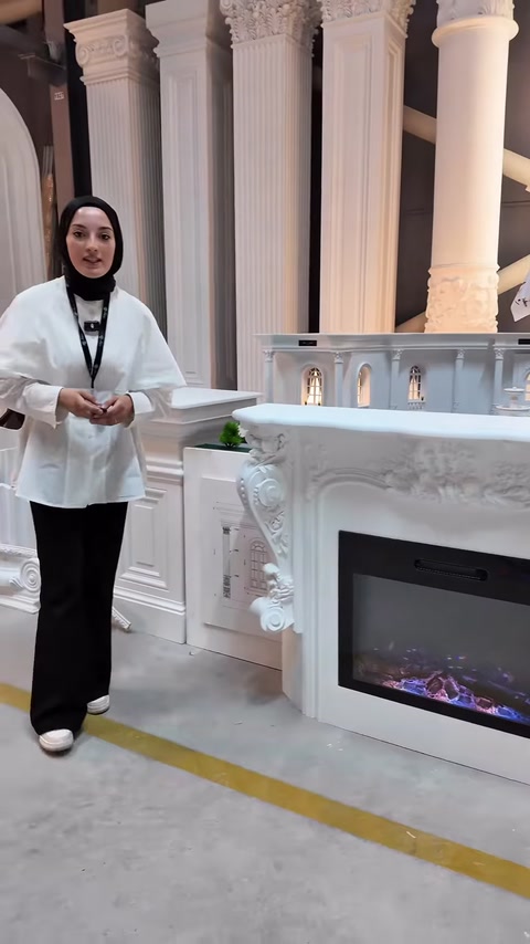 The presenter introduces the decorative fireplace and the surrounding column models
