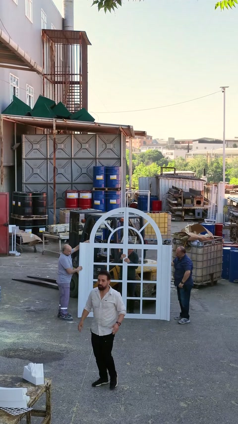 Arched window layout checked with workers in open area