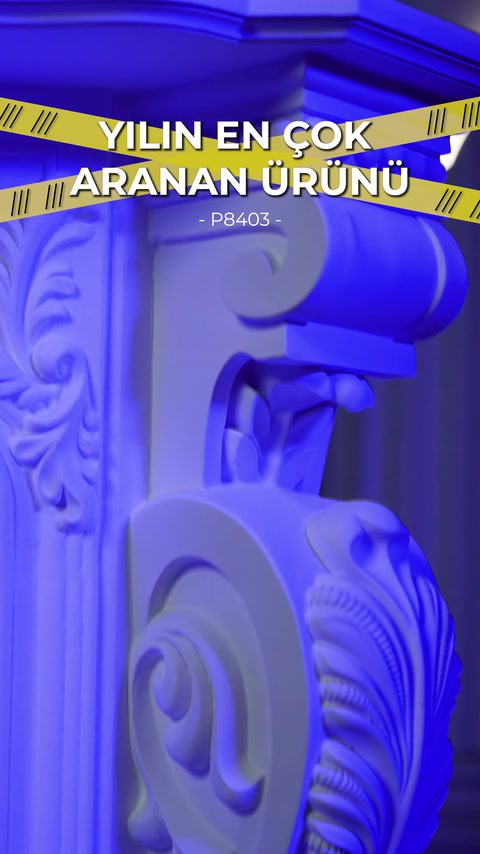 The scrolling upper corner ornament of the decorative fireplace is shown in detail.