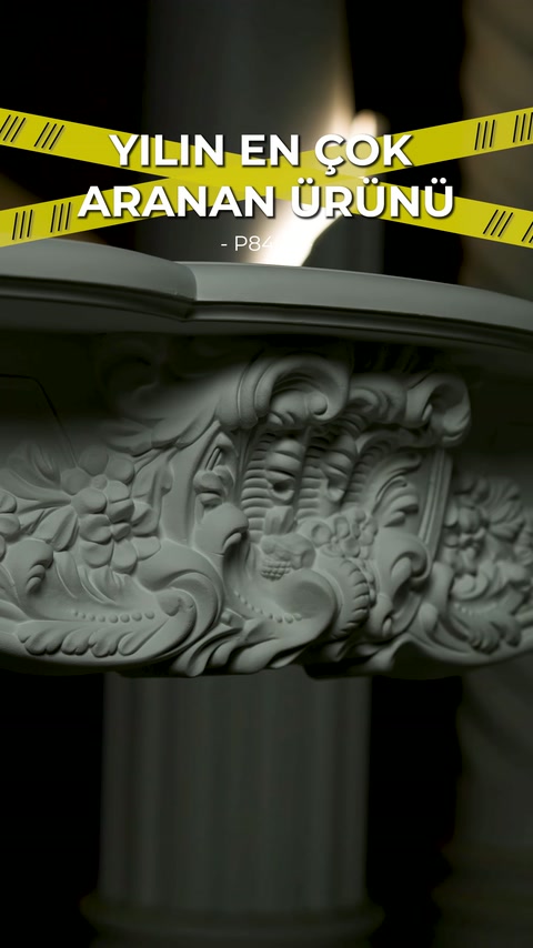 Decorative fireplace surround heavily embossed header stands out against dark background.